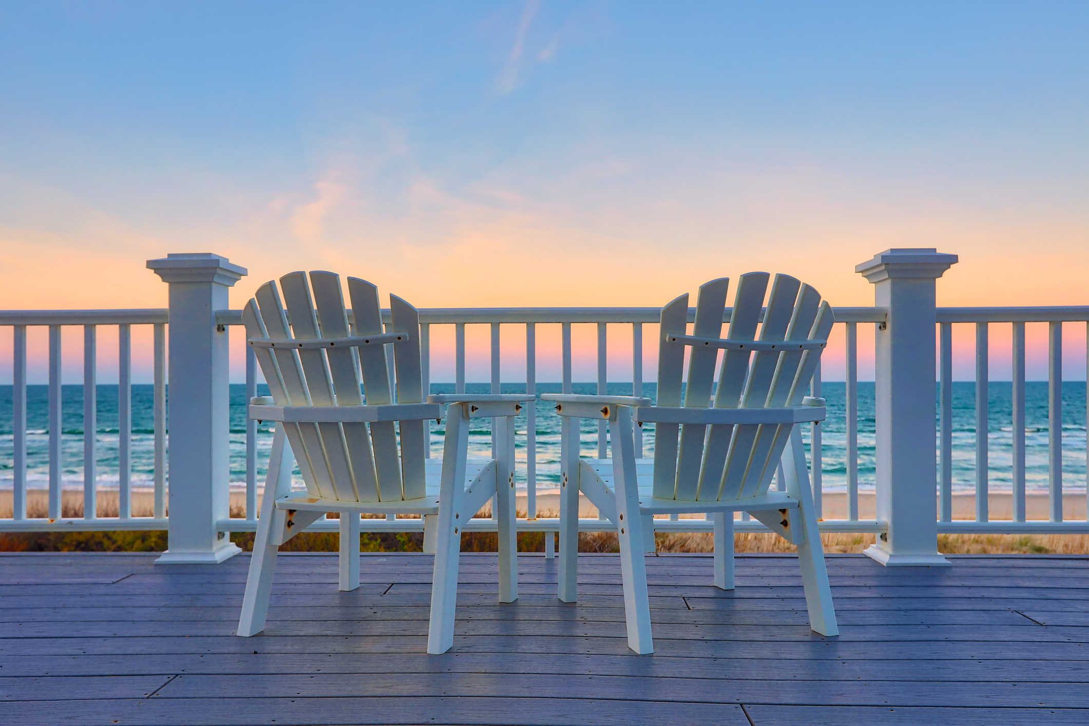 Pull up a chair overlooking emerald gulf waters from a coastal terrace in Northwest Florida